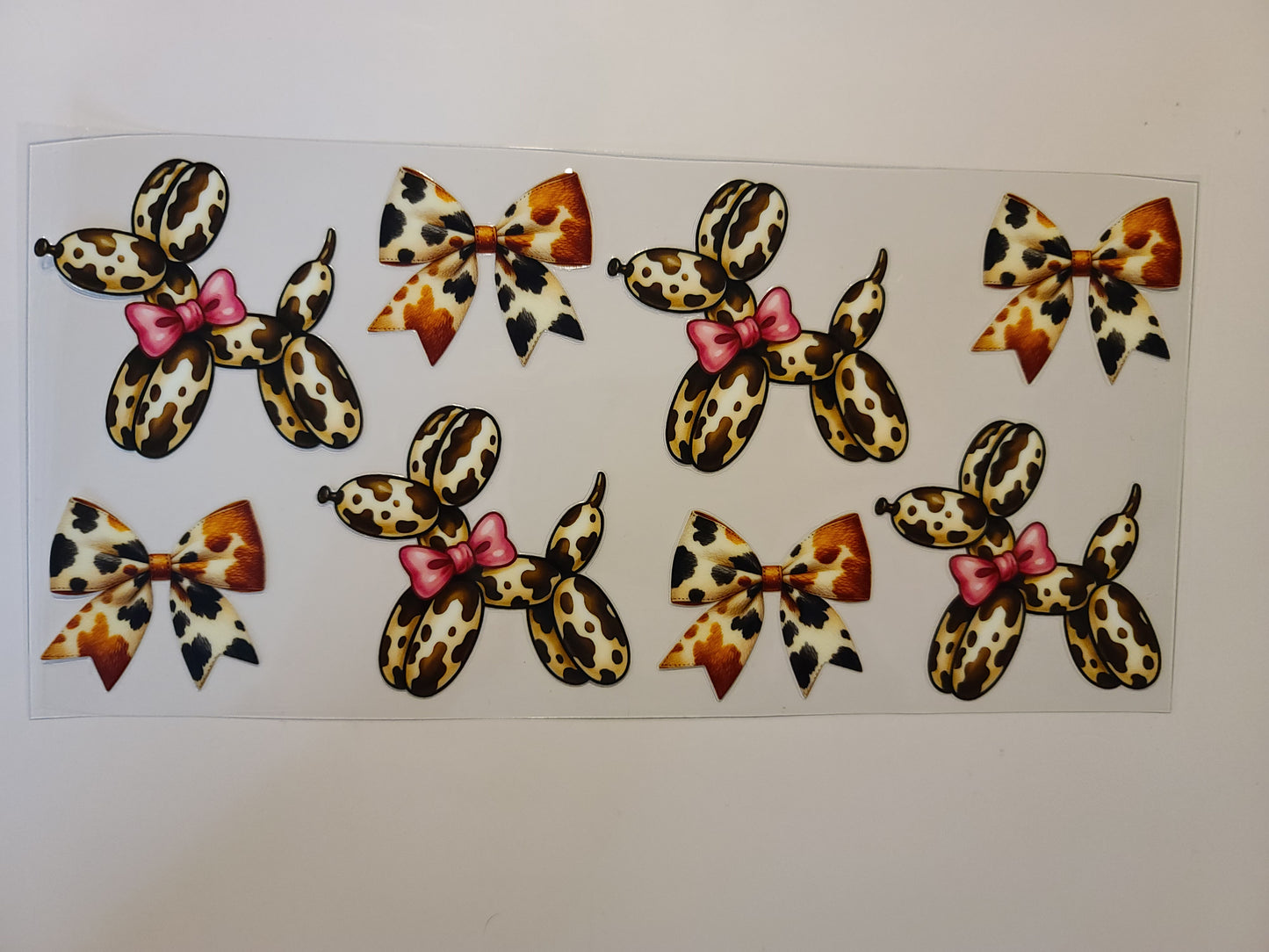 Brown Cow Print Balloon Dog With Pink Bows
